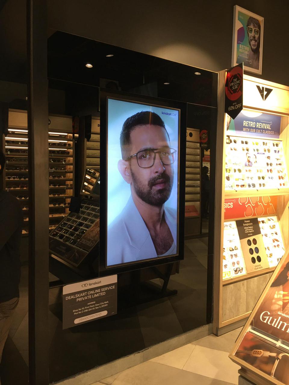 Vertical retail digital signage running live campaigns inside a Lenskart store — Vertex Edges